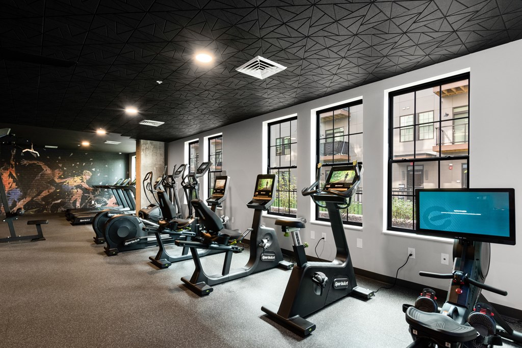 a room filled with lots of different types of exercise equipment